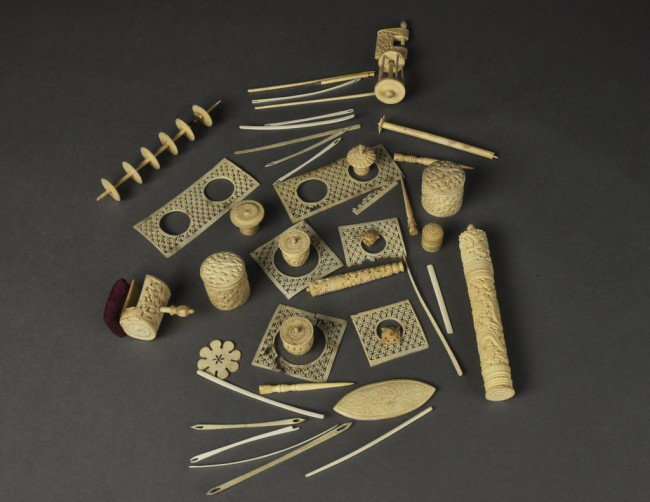 Lot of carved ivory sewing accessories including a : Lot of carved ivory sewing accessories including a winder table clamp, pin cushion clamp, round covered boxes, thimble, etc. (over 40 pcs)