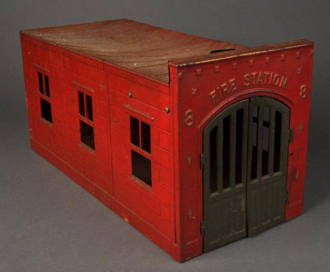 Tin Ives Fire Station "8" with hinged doors and b: Tin Ives Fire Station "8" with hinged doors and bell mechanism. Height: 10"" Length: 19 1/2" Width: 8 3/4"