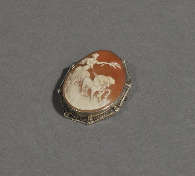 14k white gold set shell cameo of lady in chariot: 14k white gold set shell cameo of lady in chariot with two horses. Height: 2""