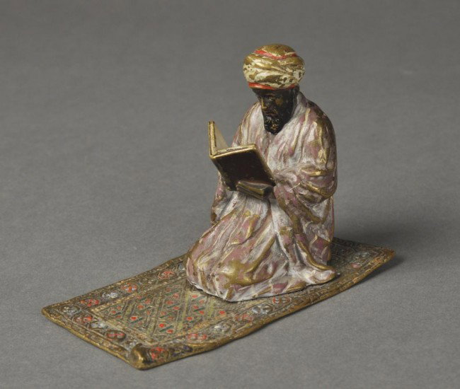 Austrian bronze figure of a man on prayer rug, hal: Austrian bronze figure of a man on prayer rug, hallmarke on bottom. Height: 3 5/8""