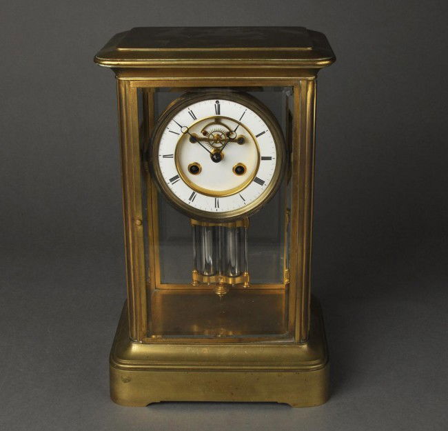 French brass crystal regulator clock with an open: French brass crystal regulator clock with an open escapement and mercury pendulum. Height: 14""