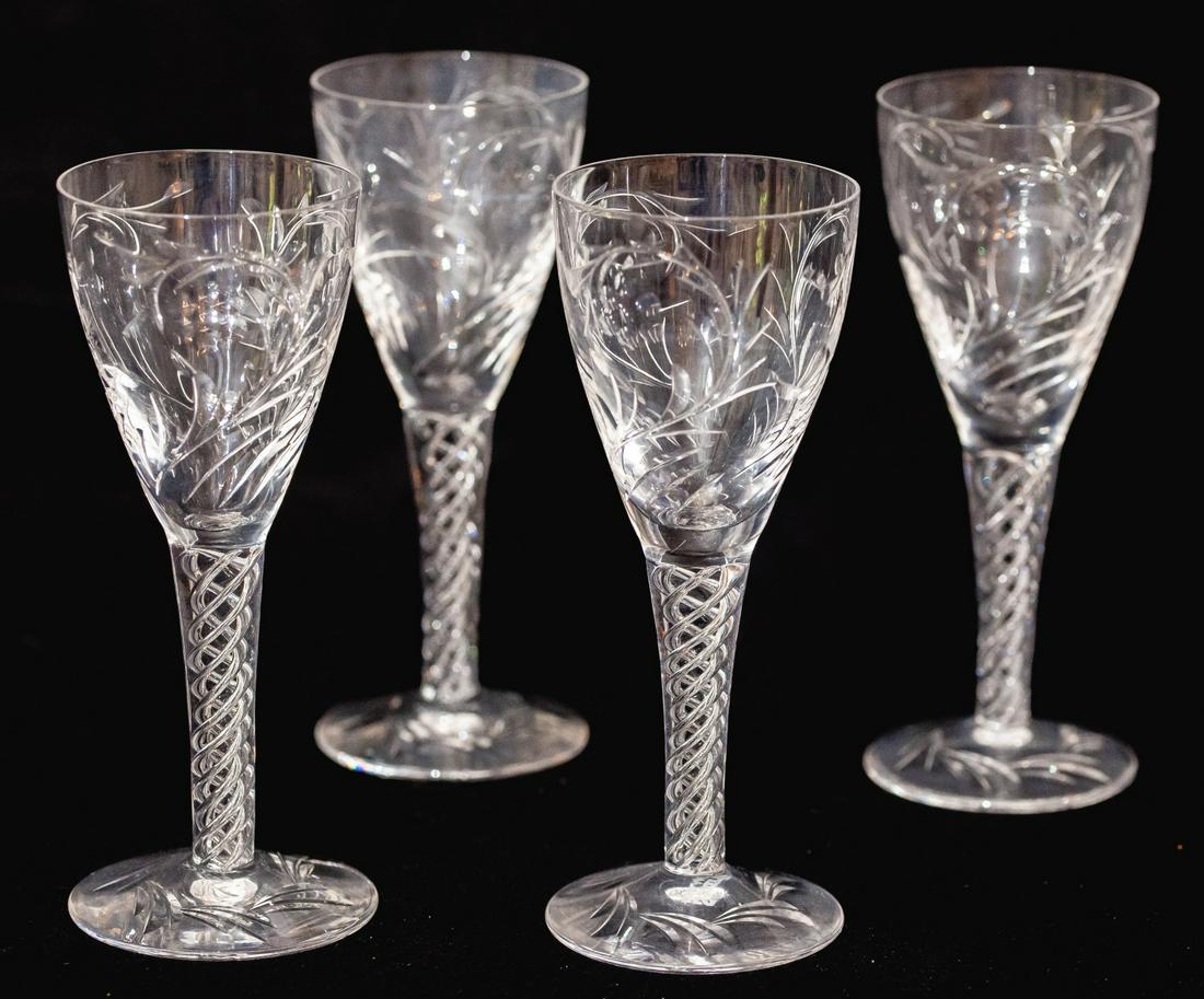 (4) STUART ENGLAND "ARIEL" APERITIF GLASSES: Fonts engraved with floral motifs and air twist stems. 6 inches Condition: GoodTemp No 152