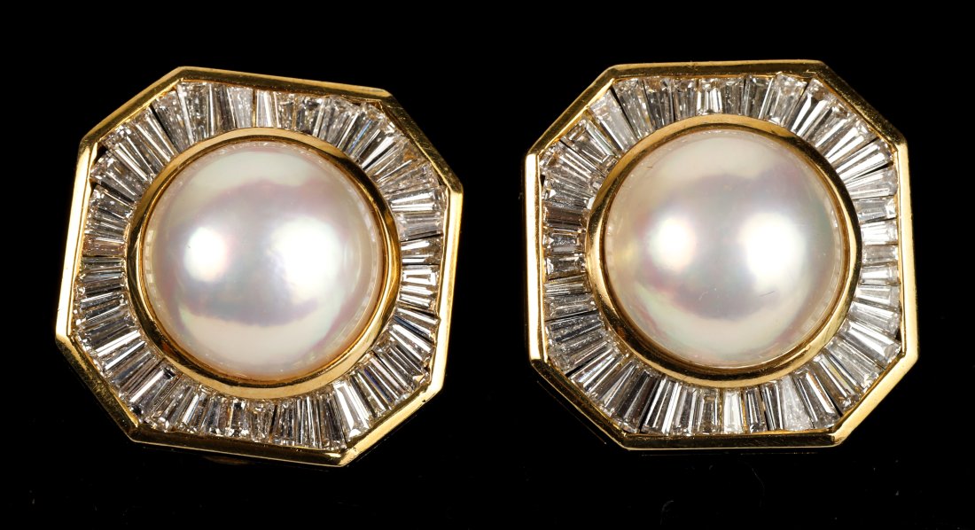 PAIR OF PEARL, DIAMOND & 14k WHITE GOLD EARRINGS: Each centered with a mabe pearl measuring approximately 12.7mm surrounded by an aureole of tapering baguettes with a total diamond weight of approx. 2.58 carats. clip backs total weight 13.2dwt
