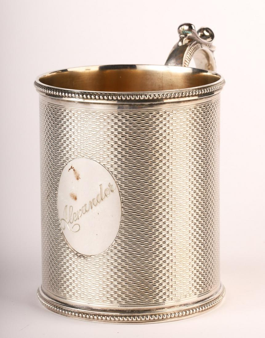STERLING HANDLES CUP: with London hallmarks, 4” overall, inscribed "Alexander" Total ozt 5.0 Condition: See PhotosTemp No 8020