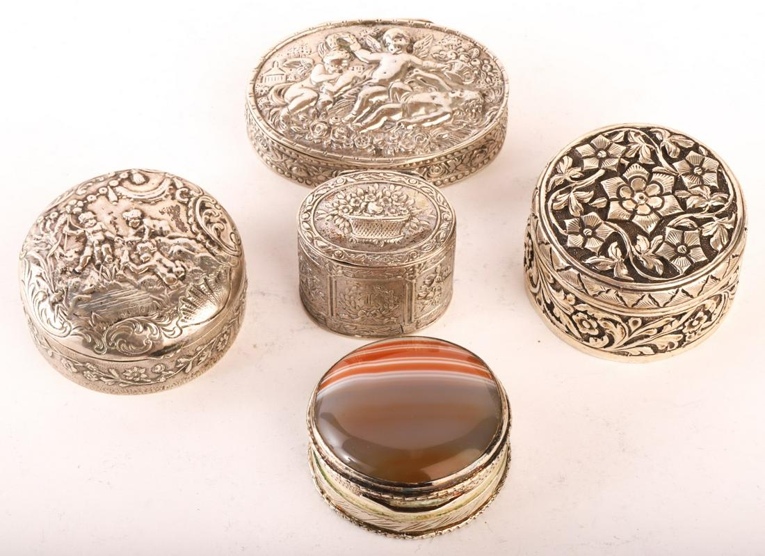 (5) SILVER PILL BOXES EMBOSSED with CHERUBS etc: (2) Stamped 800. Largest measures 2 1/4" across and weighs 1.34 oz t. (4) without stone lid weigh 4.83 oz t. Condition: GoodTemp No 8095f