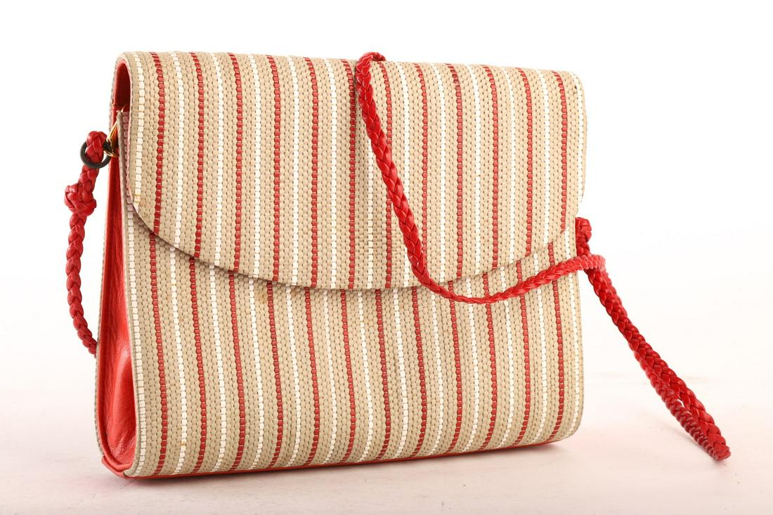 MARK CROSS LEATHER PURSE: Wove exterior. 7 x 8 inches (not including 40 inch strap. Condition: GoodTemp No 8491