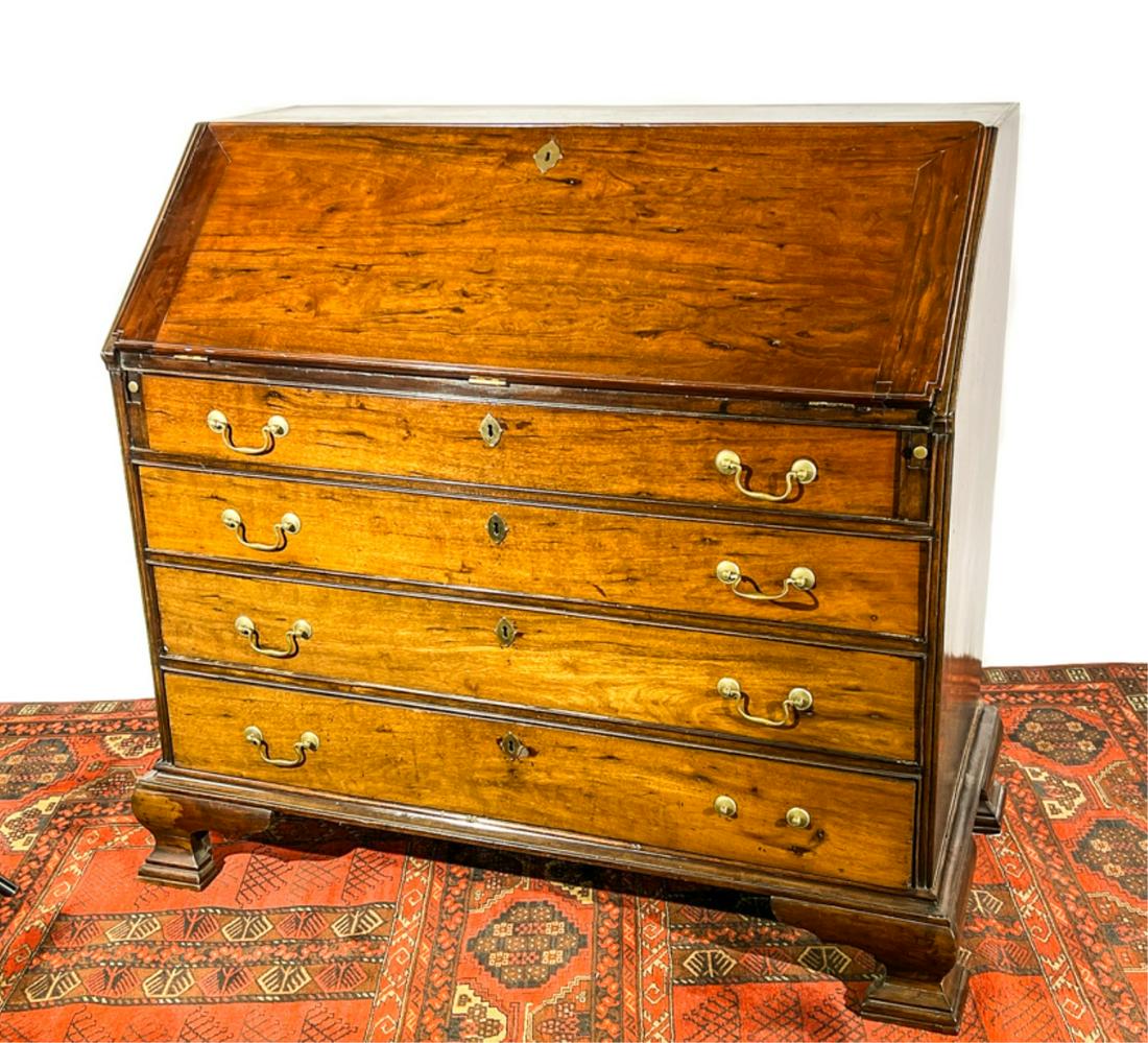 MAHOGANY CHIPPENDALE SLANT FRONT DESK ON OGEE FEET: (4) Drawer desk with multi compartmented interior. 44 x 45 1/2 x 24 1/2 inches. Condition: (3) Dutchman repairs on interior fall front. Missing back boards. Repairs to drawers, losses, expected wear. 