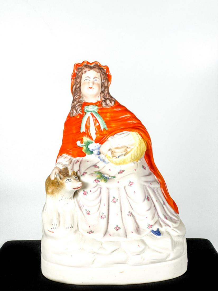 STAFFORDSHIRE LITTLE RED RIDING HOOD FIGURE: Hand painted with Big Bad Wolf. 10 1/2 x 7 1/2 inches. Condition: Good.