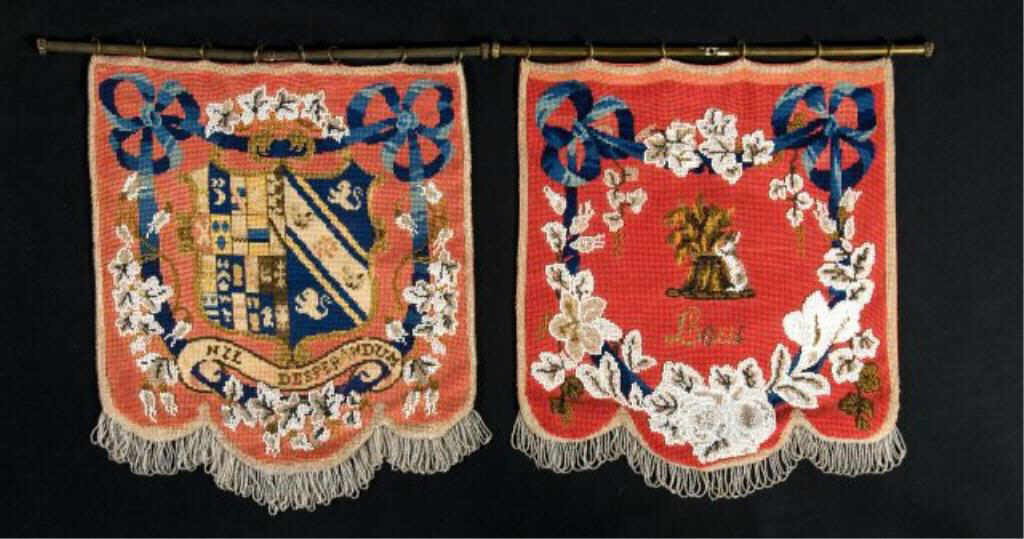 Pair of armorial needlepoint wall hangings,: 19th century with glass beading, backed on silk, H: 18" W: 16"