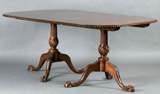 Mahogany Chippendale Style Dining Table: 2nd quarter of the 20th Century labeled "Marlboro Manor, Fine Furniture by Sacks", D-End top having rope boarder and two 18" leaves, supported by double fluted pedestals having tripod cabriole legs wi
