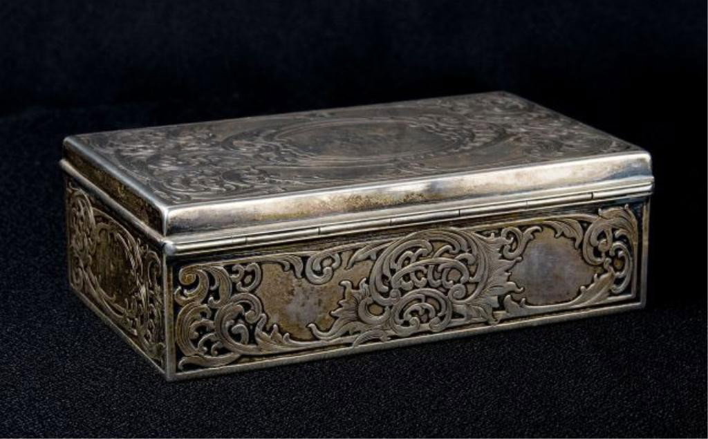 Sterling cigarette box,: Shrieve Crump and Low with raised decoration dated 1910; wood interior, 10 troy oz. 3.75" X 5.5 X 1.75