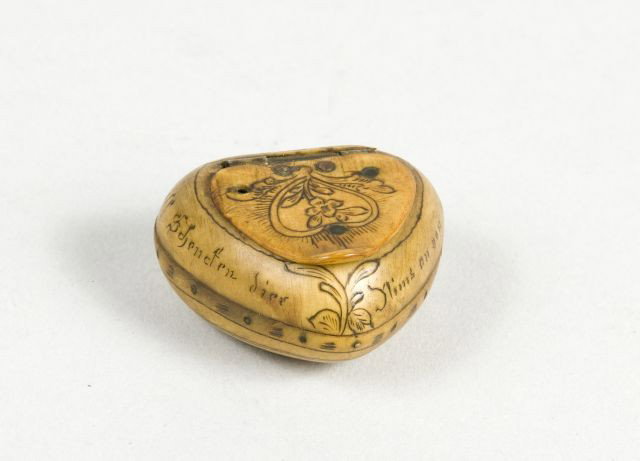 Early 19th Century Horn Pill Box: in form of a heart and scrimshawed with verse, 1 1/4" x 1 1/2"
