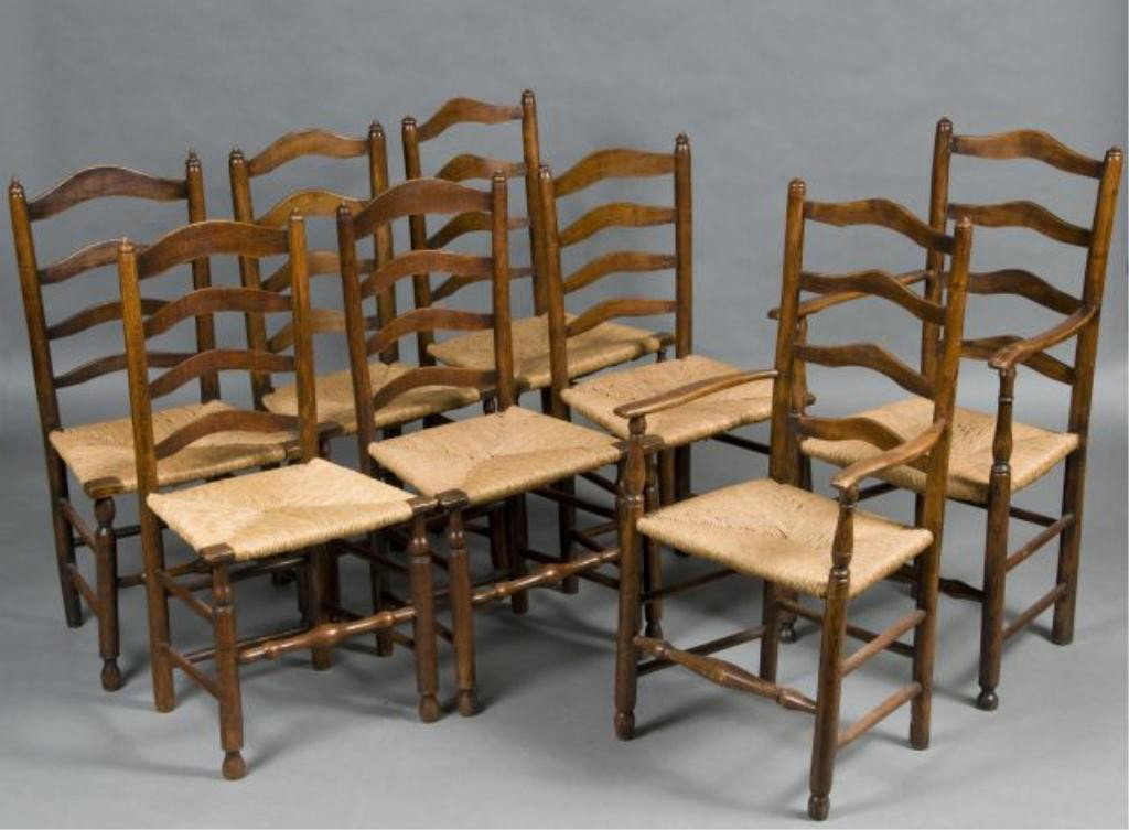 Assembled set of eight English country ladder bac: chairs; circa 1820; elm with rush seats; two armchairs and six side chairs; some with bulbous stretches