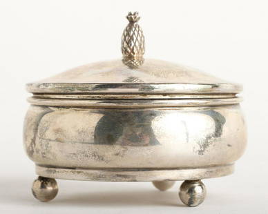ROUND CARTIER FOOTED STERLING SILVER JEWELRY BOX: with Pineapple Finial Approx. 2 1/2" x 3". 2.79 ozt overall including padding Condition: Ref photos or call for more info Temp No 5010
