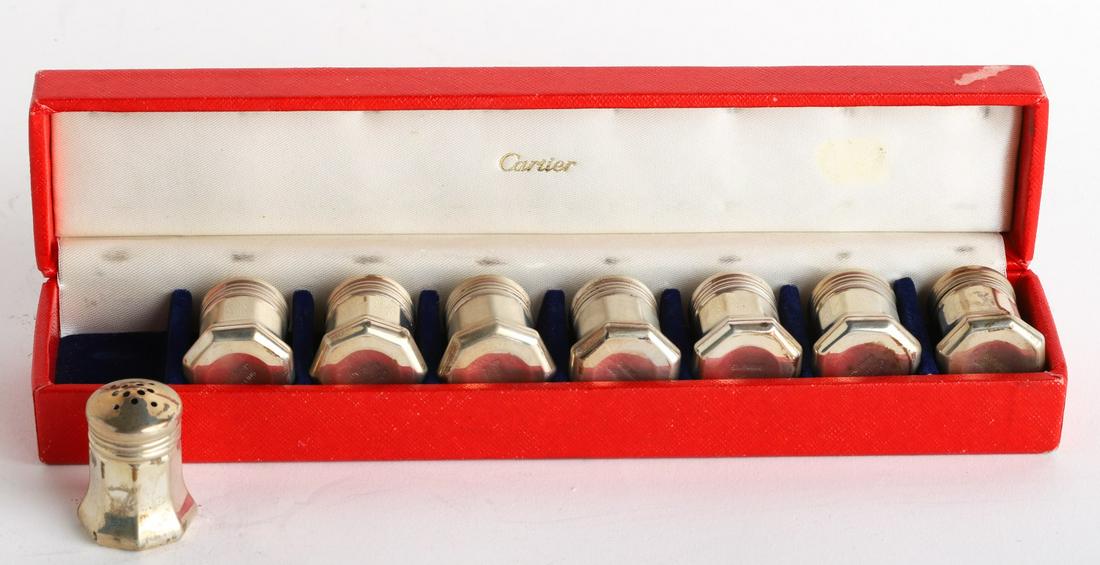 SET OF (8) CARTIER STERLING SILVER SHAKERS: 2.14 ozt. . 1 3/8" tall. In original box Condition: Ref photos or call for more info Temp No 5033