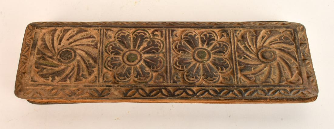 ANTIQUE TIBETAN SANSKRIT PRAYER BOOK: Chip-carved wooden boards opens to handwritten manuscript on thick wove paper. Loose-leaf and unbound. Condition: Toning, wear to edges of text block Temp No 6548