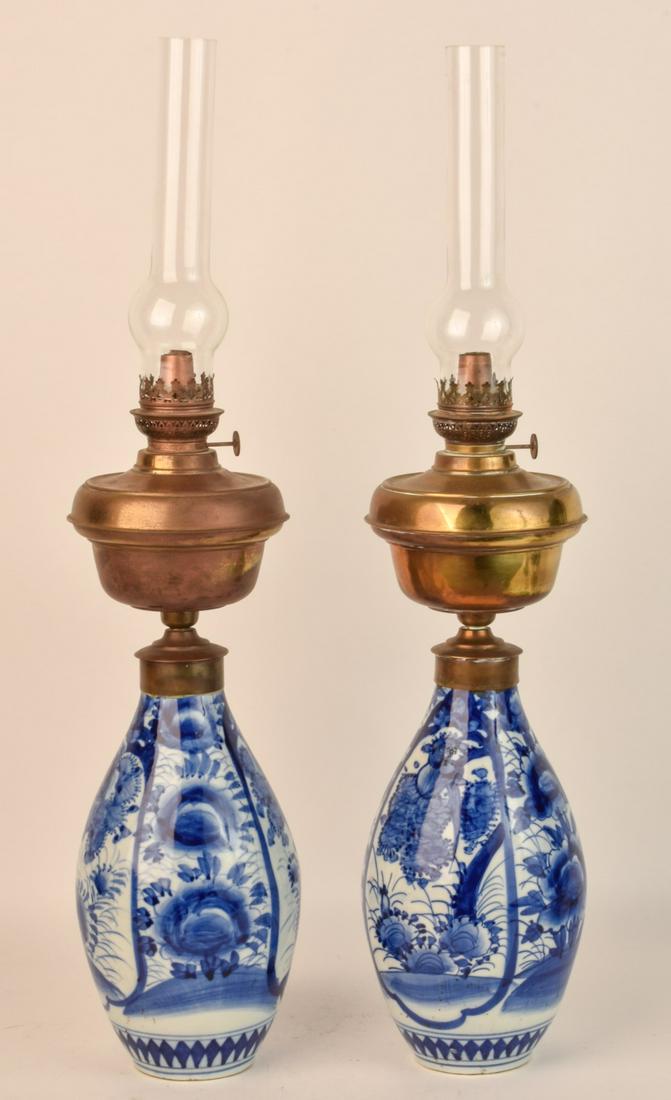 PAIR OF MEIJI PERIOD PEAR-FORM JAPANESE ARITA VASES: 12 inches. Mounted with brass fonts with argon burners. 30 inches (to top of chimneys) Condition: Manufacturing defect to side of (1) vase Temp No 6576