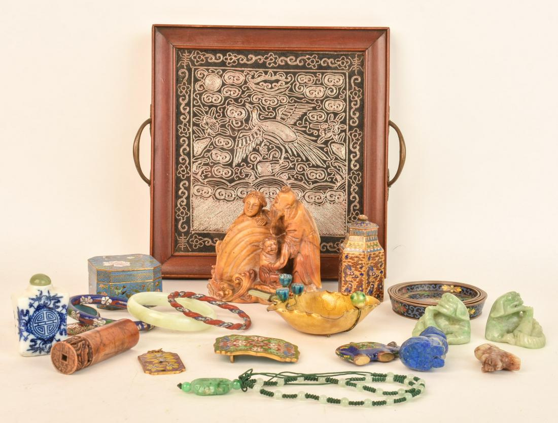 TRAY LOT OF ORIENTALIA: Including: Carved hardstone and soapstone figures, cloisonne and enamel wares, jewelry, belt buckles, porcelain snuff bottle. Together with a (2) handled tray set with a metallic thread embroidery. 10