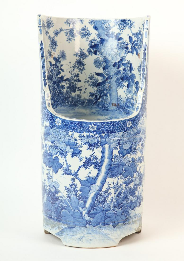 C1880's JAPANESE MEIJI PERIOD PORCELAIN URINAL: From Arita and decorated with an elaborate landscape with a variety of flowering plants. 27 x 13 3/4 inches.