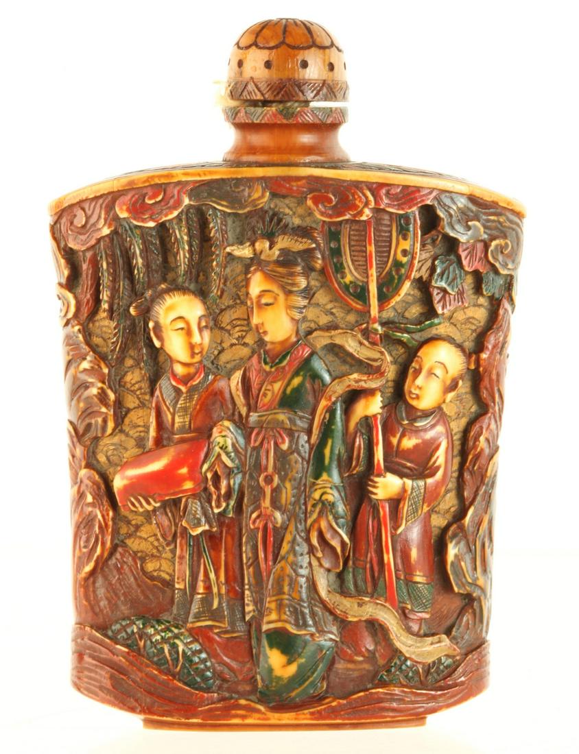 CHINESE CARVED BONE SNUFF BOTTLE SIGNED: Women, servants and children carved in low relief and painted. signed under base 3 inches. Provenance: Purchased at auction in the 1940s by the consignor's grandfather Condition: Good Temp No 6154