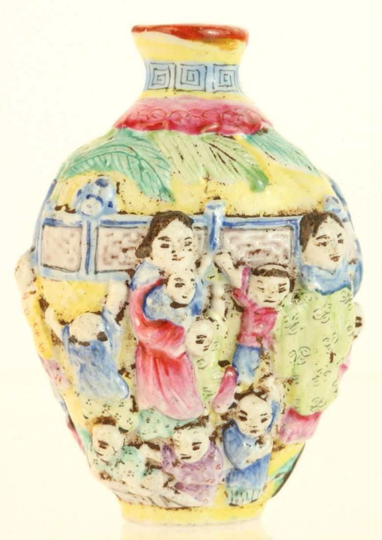 CHINESE FIGURAL PORCELAIN SNUFF BOTTLE SIGNED: Raised polychrome figures of women and children. signed under base 2 1/4 inches. Provenance: Purchased at auction in the 1940s by the consignor's grandfather Condition: Good Temp No 6133