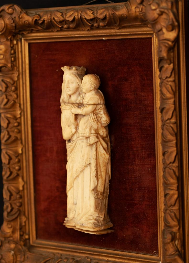 GOTHIC CARVED BONE MADONNA & CHILD FIGURE GROUP: 7 inches / 12 1/2 x 10 inches (overall) Condition: Surface grime, separation to bottom laminate Temp No 3053-276