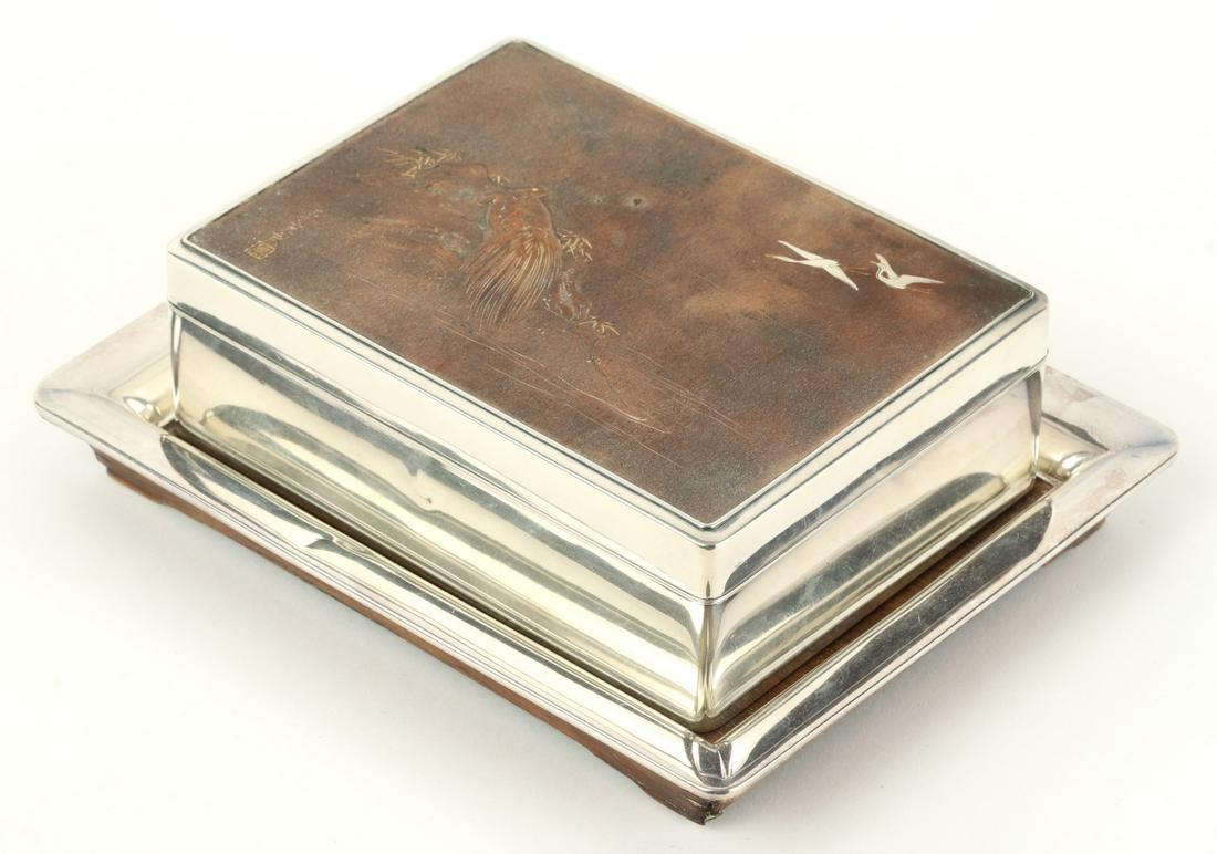 JAPANESE MINOGAME MIXED METAL DRESSER BOX: Wood lined box nests nicely on tray. . Lid features a minogame coming out of the water while glancing at a pair of birds in flight. signed with characters, marked on underside. Box measures: 2 x 5 1/4