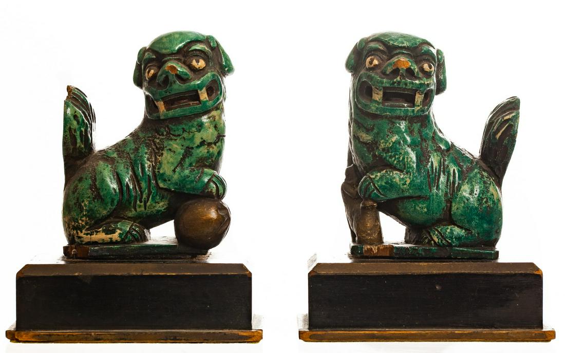 PAIR OF CHINESE GUARDIAN LION BOOKENDS: Carved and painted wood on weighted wooden plinths. 6 x 5 inches