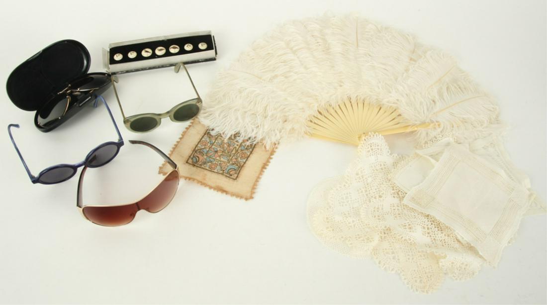 SUN GLASSES, BLAZER BUTTONS, FAN & DOILIES: Sunglasses: Armani, Porche, Foster Grant, Morgenthall Frederics; set of scrimshaw blazer button by K.E. DeLong; feather fan; and an assortment of doilie (some crocheted). Fan measures 12 x 21 inches.