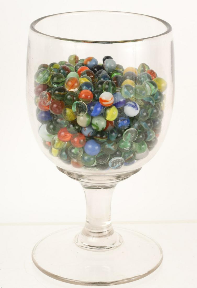 OVERSIZED GOBLET OF MARBLES: Goblet measures 10 3/4 x 6 x 6 inches.
