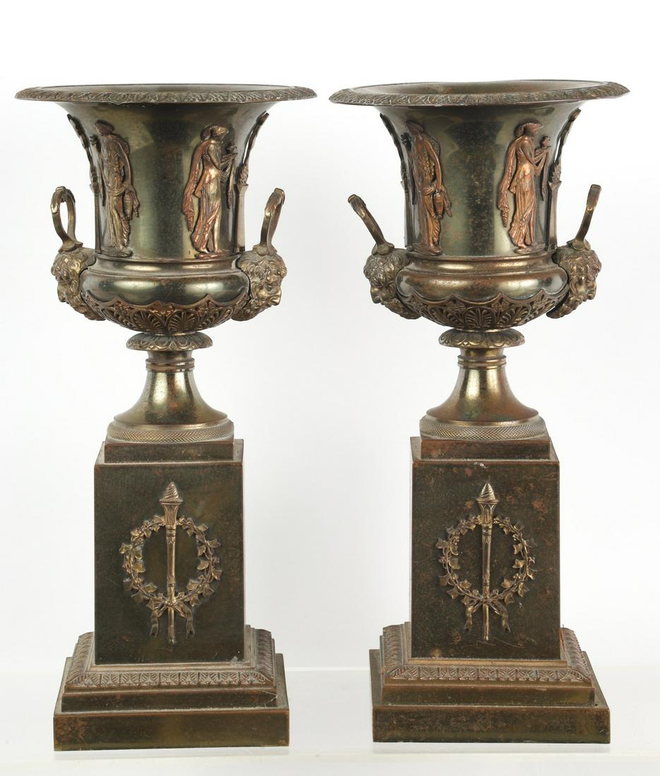 PAIR OF NEOCLASSICAL WEIGHTED BRASS URNS: 14 3/4 x 7 x 7 inches.