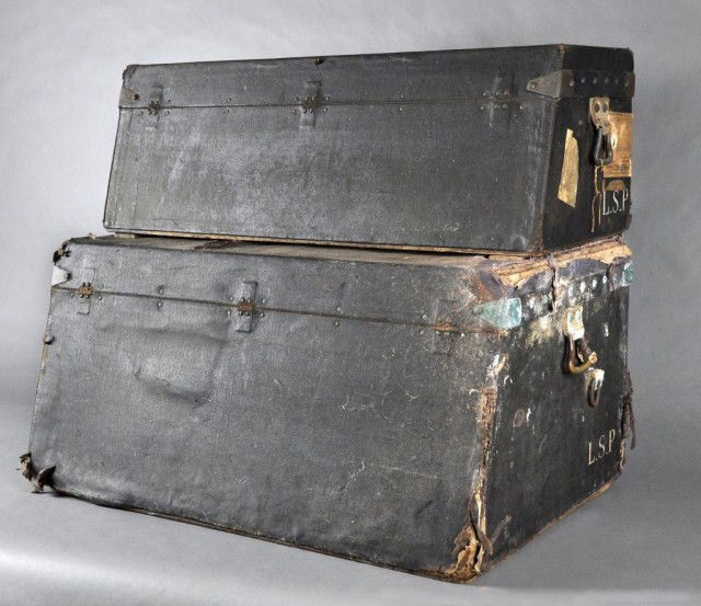 Two 19th century very rare Louis Vuitton trunks: 19th century very rare Louis Vuitton canted stacking, fitted set of trunks. All black covering with trays. Paris and London label. #147191 top, 147190 bottom. Top trunk 11 3/4"h x 14"d x 34"w bottom t