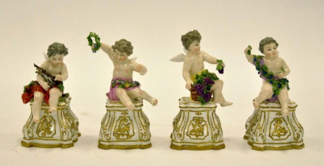 The Four Seasons, Meissen porcelain figures: The Four Seasons, Meissen porcelain figures, each seated putti holding seasonal attributes, cross sword under glaze mark, 19th century, tallest 5"h