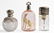 114: Lot of three glass scent bottles with silver tops
