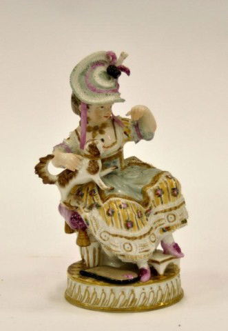 Meissen figural group modeled after a young lady: Meissen figural group modeled after a young lady seated holding a dog raised on a round socle, after the model by Acier. Blue crossed swords mark under the glaze, incised: "F50"