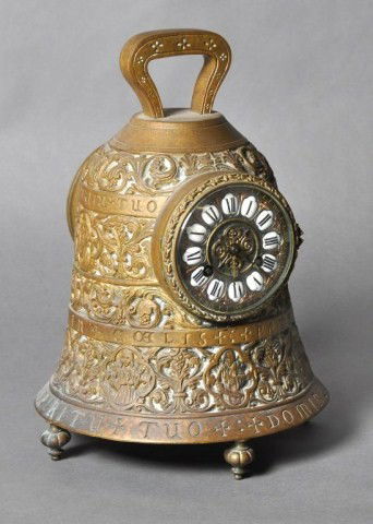 Unusual Continental bell form clock with angelic: Unusual Continental bell form clock with angelic depictions with Latin script and French eight day movement with strike. H: 13"