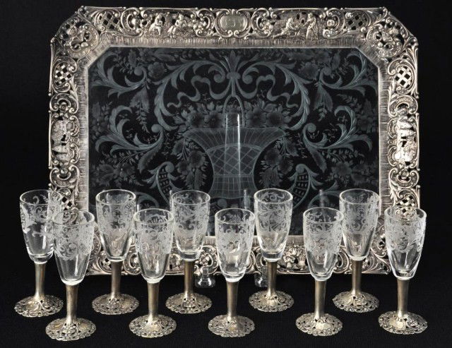 German 800 silver mounted intaglio cut cordial set: German 800 silver mounted intaglio cut cordial set consisting of 10 cordials and a tray with reticulated border, 14"w x 10