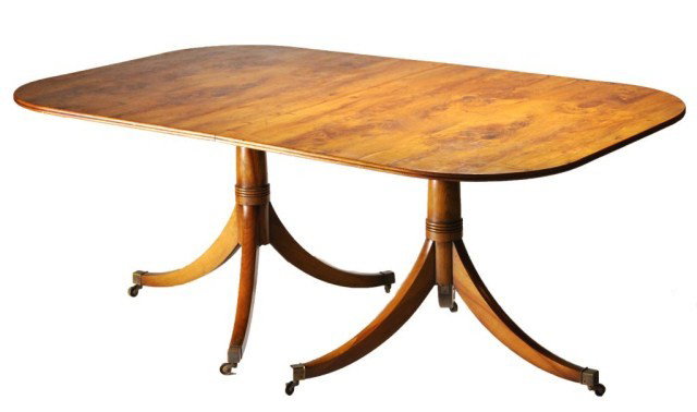 Georgian style double pedestal yew wood veneered: Georgian style double pedestal yew wood veneered dining table having tilting tops, supported by ringed standards with down swept legs ending in brass caps with casters ( one 24" leaf with horseshoe cl