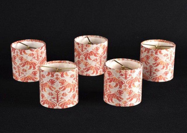 Lot of 6 Fortuni cylinder form lamp shades: Set of five Fortuni cylinder form candelabra/sconce lamp shades- Rampant lyons in orange tones, 20th century, together with a one half round blue & white example. 4 1/8" d x 4 1/8" h