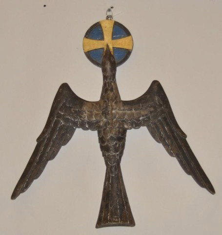 Early 20th century Wood carved and painted bird: Early 20th century Wood carved paint decorated bird with gilt cross in mouth. H: 18" W: 18"