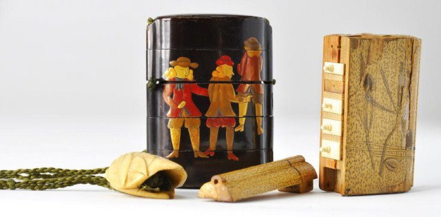 Two Japanese sagemono: Two Japanese sagemono, the first a 19th century four-case lacquer inro decorated with foreigners (repairs), with an angular bead ojime and bone netsuke in the form of a leafy peach, the second an inro