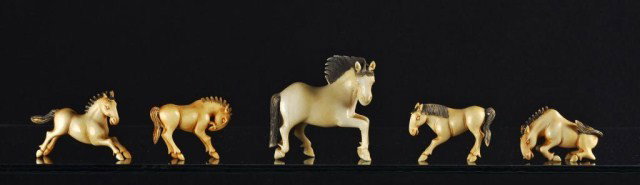 Group of nine Chinese ivory horse figurines: Group of nine Chinese ivory horse figurines, consisting of one large and a set of the 'Eight Horses of Mu Wang'. H: 2 1/2" (largest)