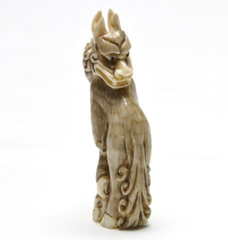 Japanese ivory netsuke, Meiji period: Japanese ivory netsuke, Meiji period, of a foo lion, signed. H: 3 1/8"
