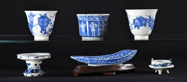 Lot of six blue and white Japanese porcelains: Lot of six blue and white Japanese porcelains consisting of a Black Ship cup, 4"d, pair of egg shell cups, a miniature footed censor, a small shaped vessel, and a boat form bowl on stand, 7"l
