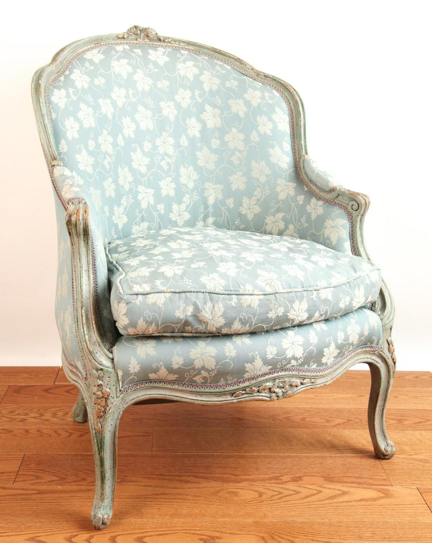 LOUIS XV STYLE ROBIN'S EGG BLUE BOUDOIR ARMCHAIR: Frame painted in robin's egg blue and carved with a floral motif. Upholstery with grape motif. 36 1/2 x 27 x 21 inches.