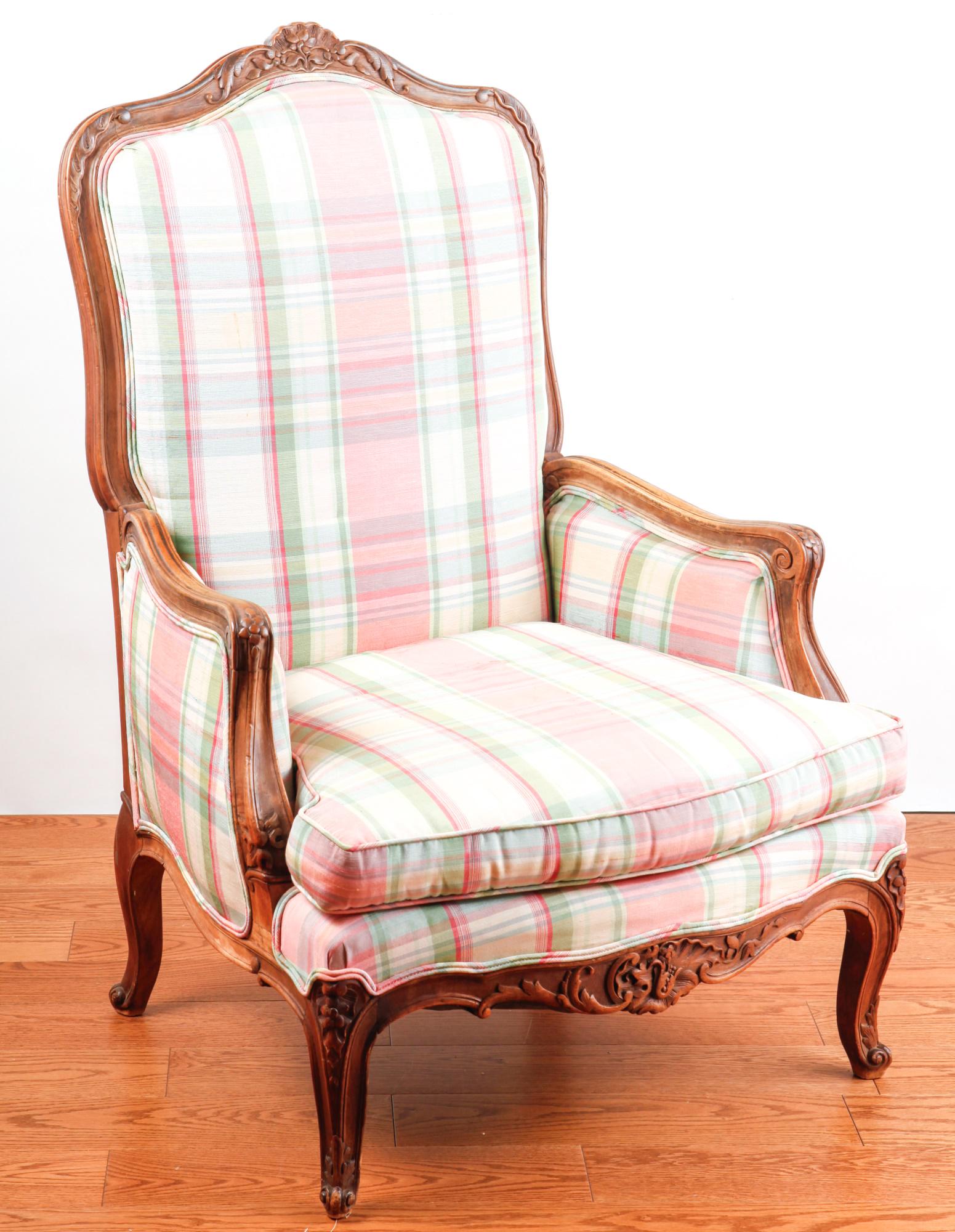 NICELY CARVED LOUIS XV STYLE EASY CHAIR: Nicely upholstered with floral carving on cabriole legs. 43 x 29 x 23 inches.