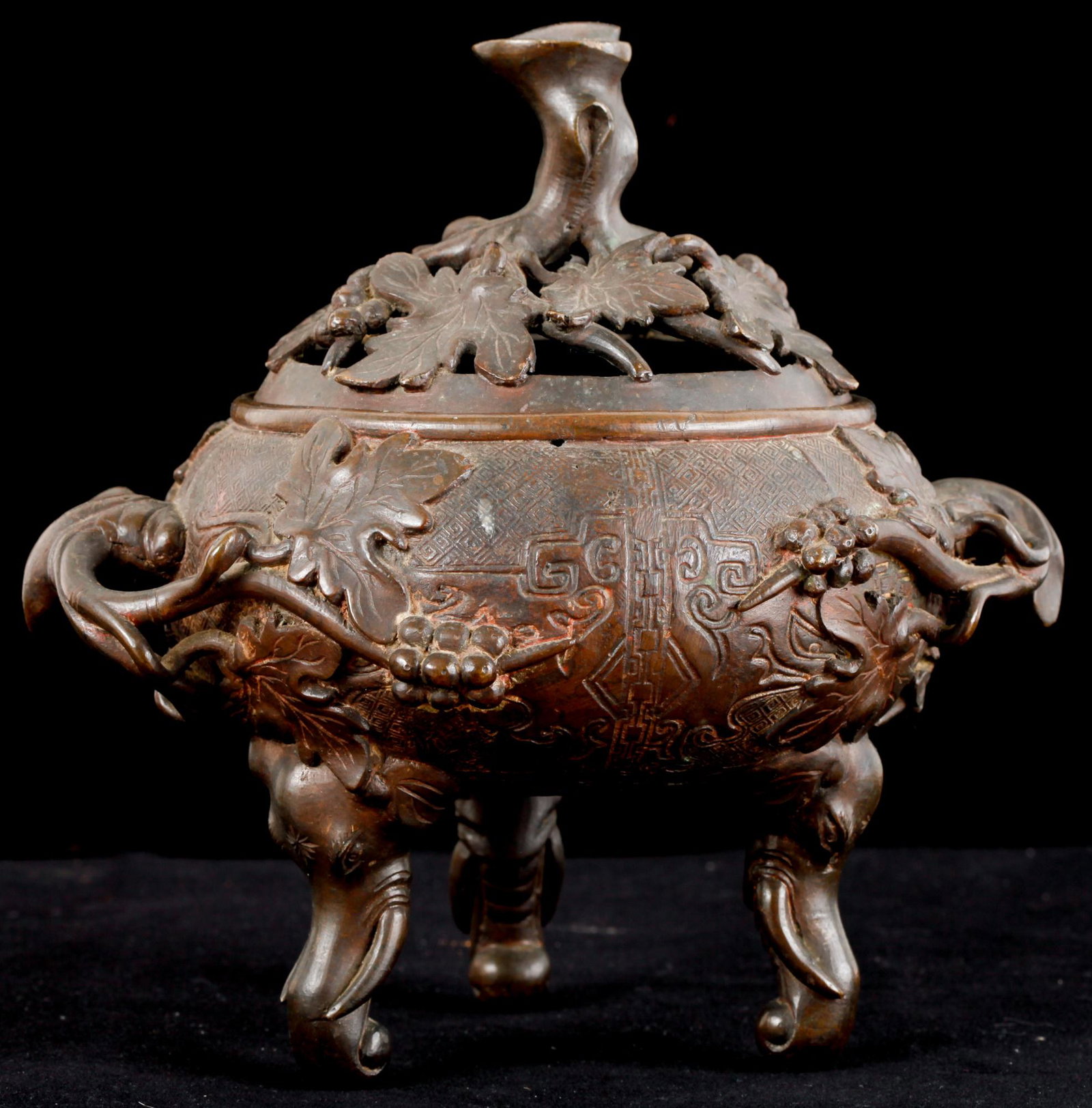 (19th c) JAPANESE BRONZE CENSER: Pierced leaf and berry motif over a diaper pattern and raised on (2) elephant head legs. unsigned. 8 1/2 x 8 1/2 x 6 inches. Provenance: Purchased at an antique shop near the Imperial Hotel in the 195