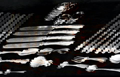 GROUPING OF STERLING & COIN SILVER TABLEWARES: Includes (10) matching coin silver butter knives, a salt with cobalt glass insert, salt spoons, tea spoons, marrow scoop, child's spoon, (2) napkin rings, a shell form bon bon scoop, an 1851 souvenir