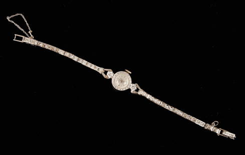 BULOVA 14k GOLD & DIAMOND LADY'S WRIST WATCH: 1/2 inch dial and 6 inch band. 9.5 dwt.