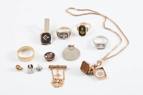 GROUPING OF MASONIC JEWELS and JEWELERY: Including: 14k Gold ring set with gemstone, 14k white gold ring set with crystal, 10k gold band, Unmarked Simmons fob chain with jewels, 10k gold Eastern Star pin and an unmarked ring set with a blood